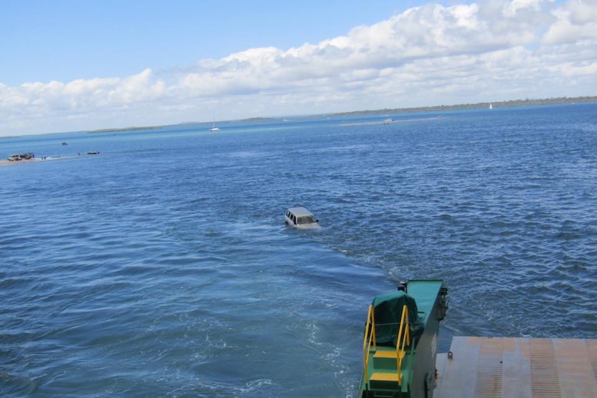 A four-wheel drive has fallen off a barge