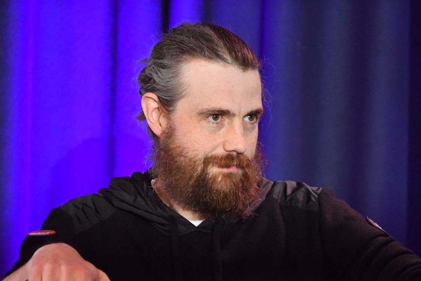 Atlassian CEO Mike Cannon-Brookes attends the second bush summit in Cooma, looking into the crowd