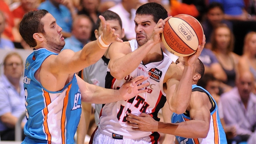 Kevin Lisch is hassled by the Blaze defence.