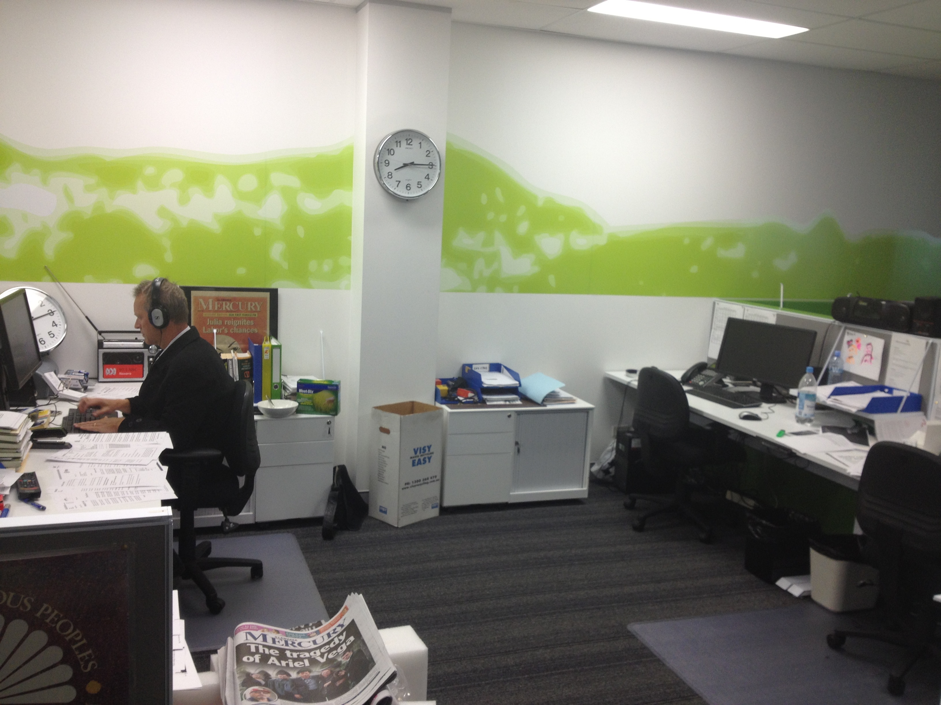 Man sitting at the table wearing headphones