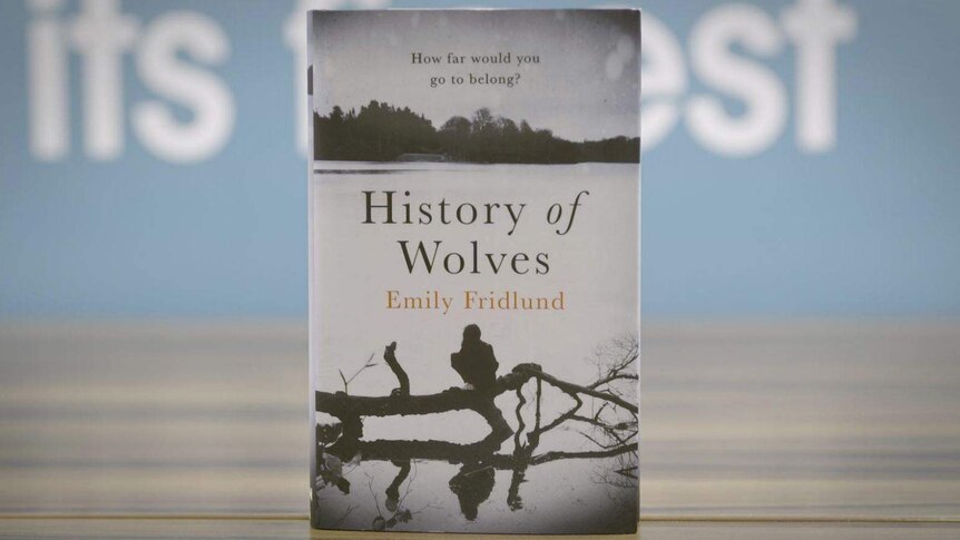 Colour photograph of the History of Wolves by Emily Fridlund book standing on a table top.
