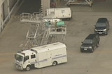 A police van drives from Tullamarine