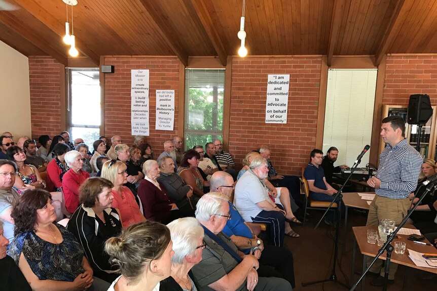 Residents of a Wantirna caravan park hold a meeting