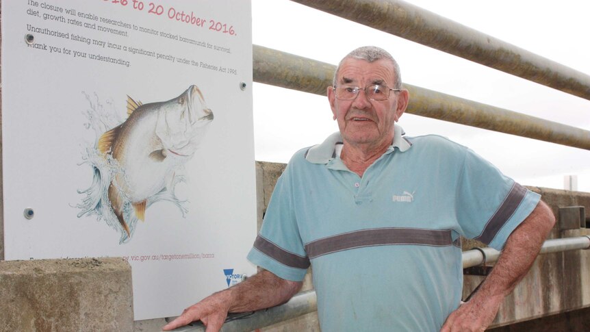 A sign says barramundi fishing is banned until October.
