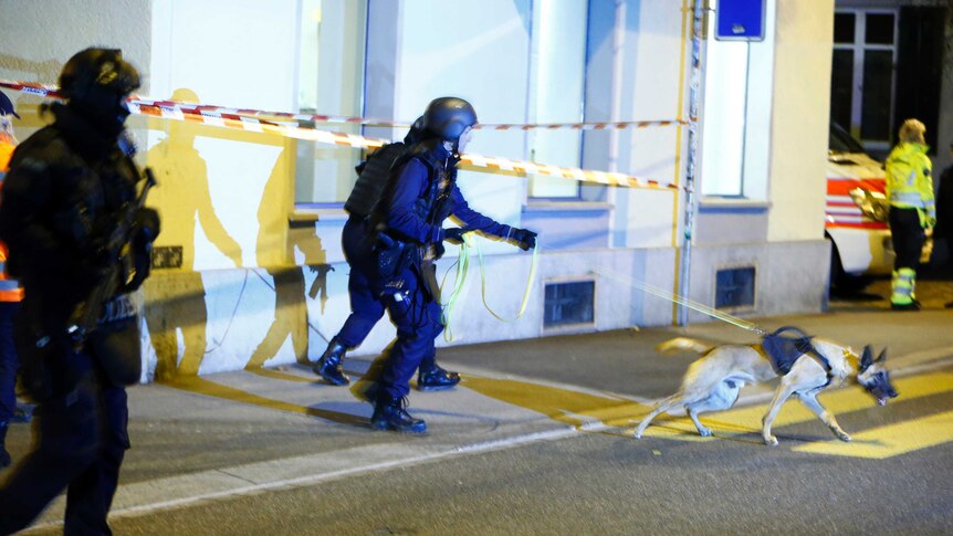 Police stand outside an Islamic centre in central Zurich, Switzerland