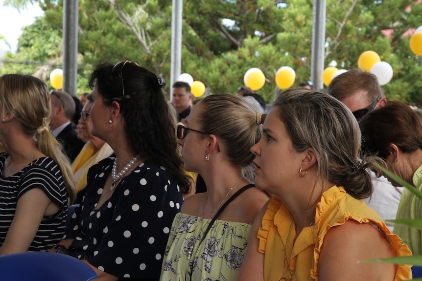 Hundreds wore yellow to signify the school house that Olivia captained.