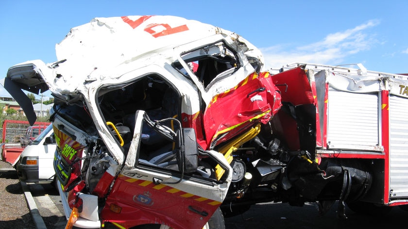 The Tasmanian fire truck damaged in collision with a semi-trailer.