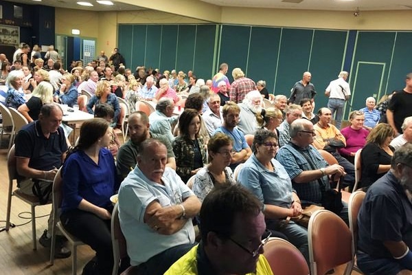 Residents meet to discuss a class against against Defence