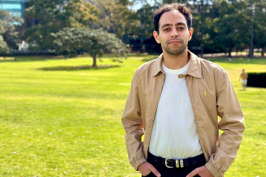 fahad ali from the Palestine Action Group stands outdoors with his hands in his pockets posing for a photograph