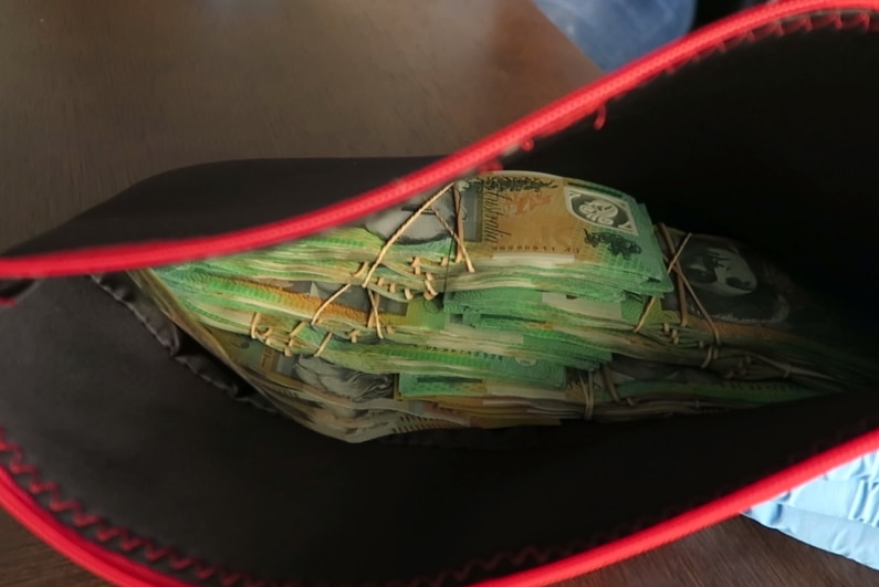 A bundle of 100 dollar bills seized by police during a drug bust in Darwin.
