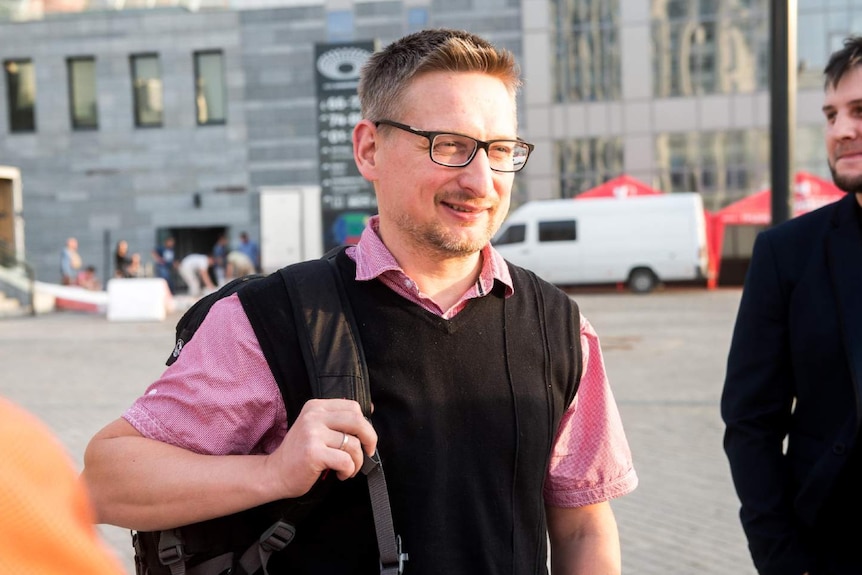 A man carries a bag