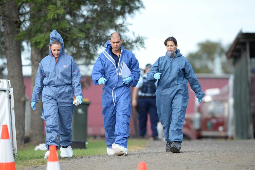 NSW Police forensic officers at the scene of a home invasion on Elizabeth Drive in Badgerys Creek.