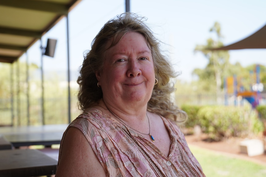 A woman from the Karratha Autumn Club looks into camera