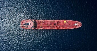 A tanker at sea as viewed from above.