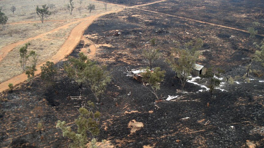 Aerial photo of destroyed sheds and burnt out land near Jericho, east of Longreach in central-west Qld.