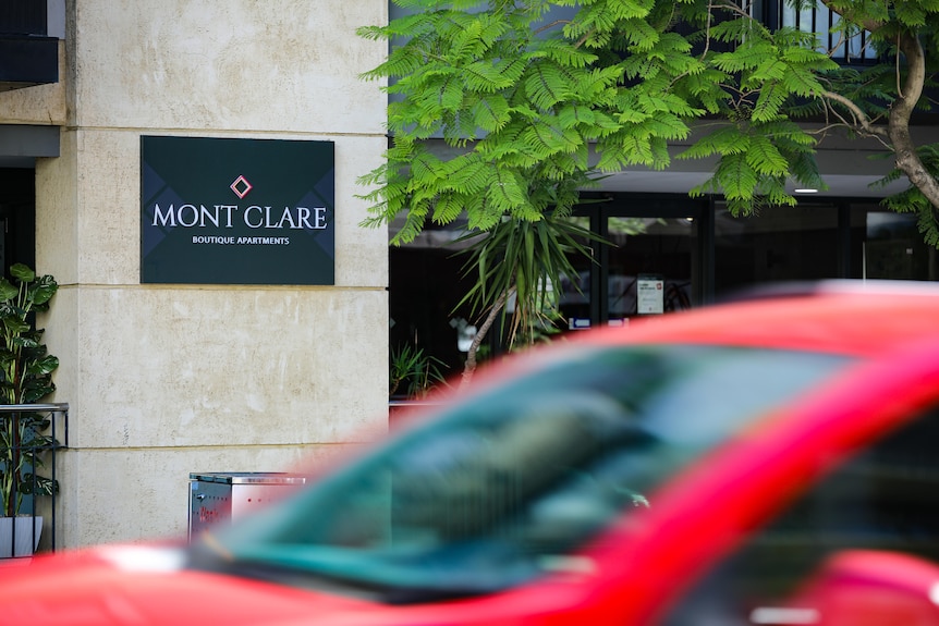 A close-up shot of signage outside the Mont Clare Boutique Apartments in Perth.