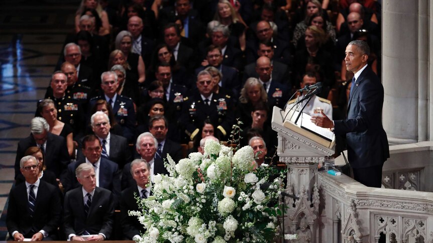 Barack Obama speaks at a memorial service.