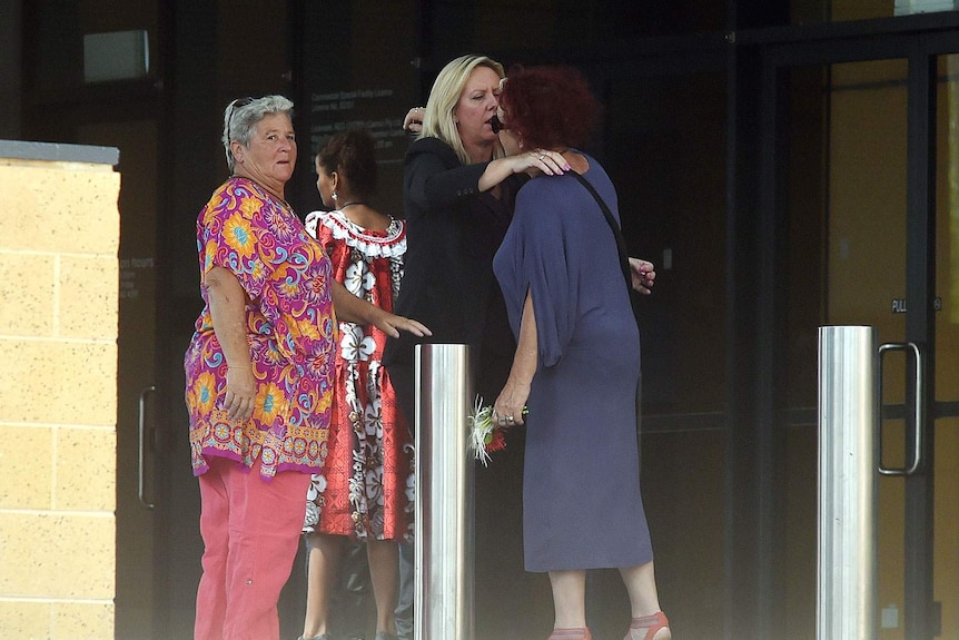 Mourners arrive at the Cairns Convention Centre for the funeral service.