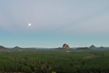 A wide angle shot of forestry plantation and Glasshouse Mountains.
