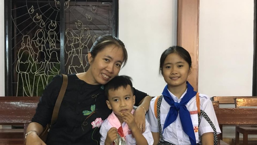 Vietnamese political prisoner Mother Mushroom with her two young children.