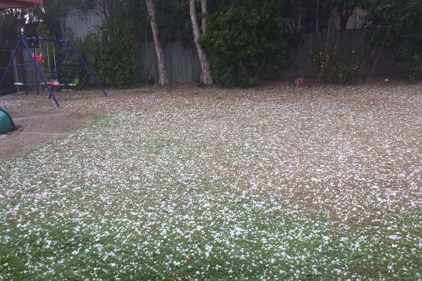 Hail blankets a backyard at Kenmore