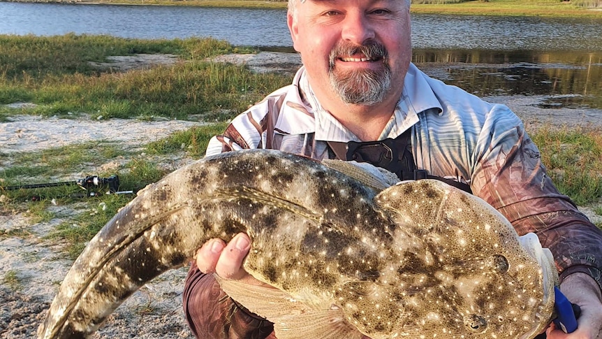 Shane Porter with a 93-centimetre dusky flathead.