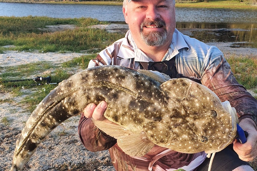 Shane Porter with a 93-centimetre dusky flathead