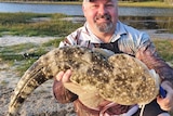 Shane Porter with a 93-centimetre dusky flathead.