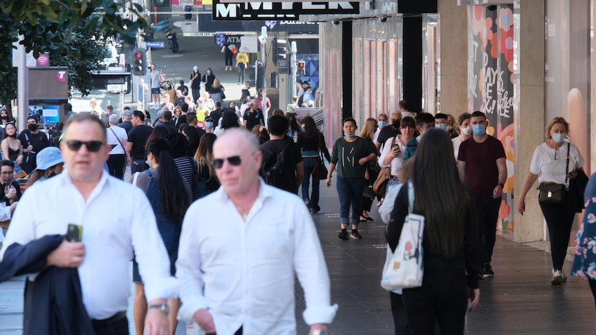 A busy shopping mall with multiple pedestrians in Melbourne's CBD.