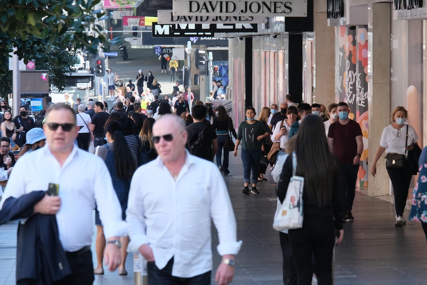 A busy shopping mall with multiple pedestrians in Melbourne's CBD.