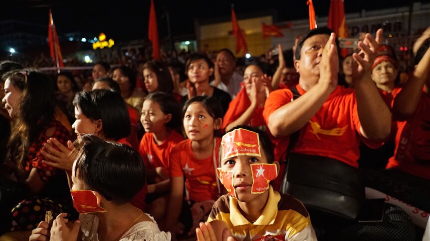 People gather at a National League for Democracy rally in Yangon