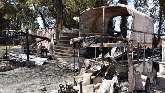 Burnt out horse float in a Wasleys yard