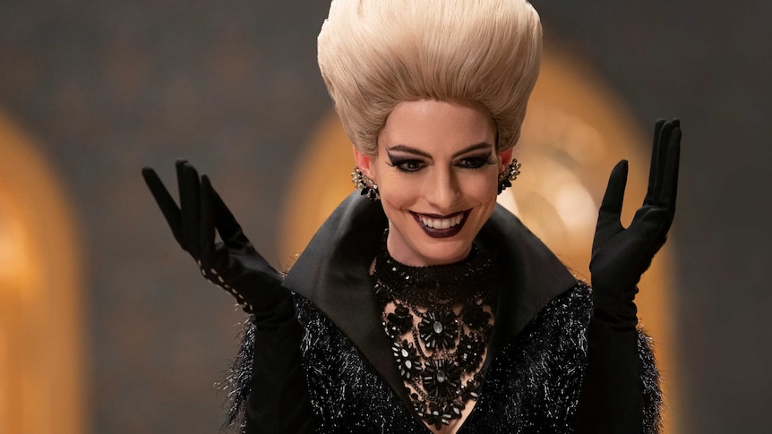 Anne Hathaway as a witch with big hair and black outfit in the movie The Witches