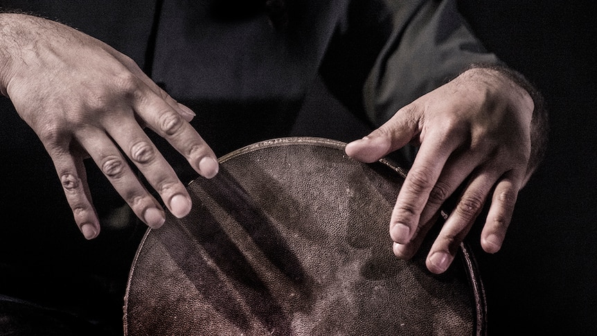 Man playing a drum