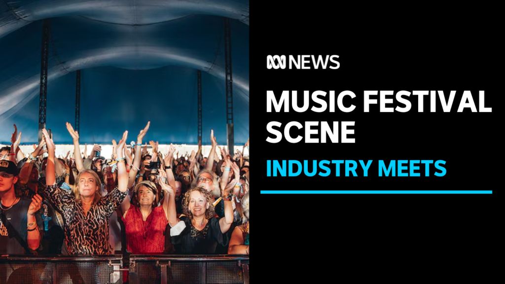 Music Festival Scene, Industry Meets: A crowd of people at a music event with their hands in the air.