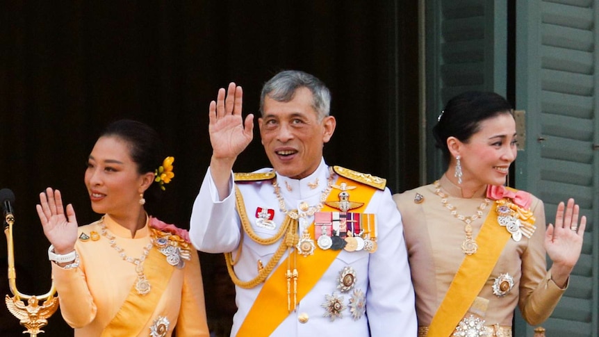 Thailand's newly crowned King Maha Vajiralongkorn, Queen Suthida and Princess Bajrakitiyabha are pictured at the balcony of Suddhaisavarya Prasad Hall at Bangkok's Grand Palace