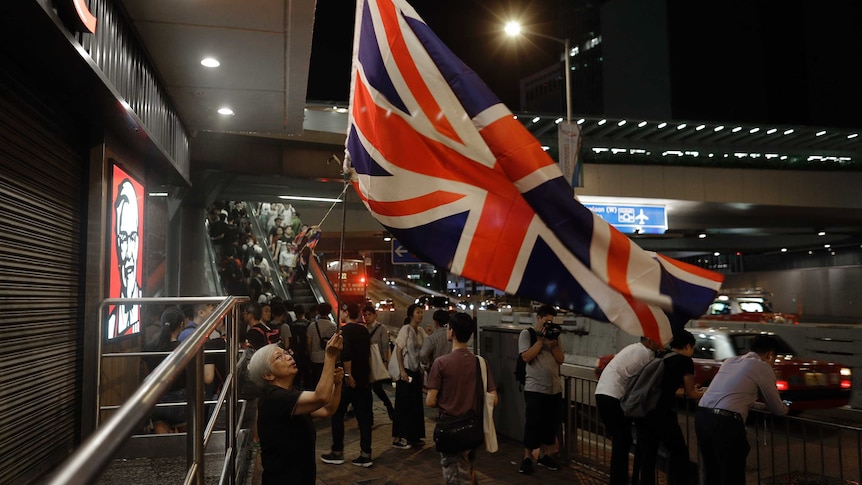 Hong Kong protester waves British flag