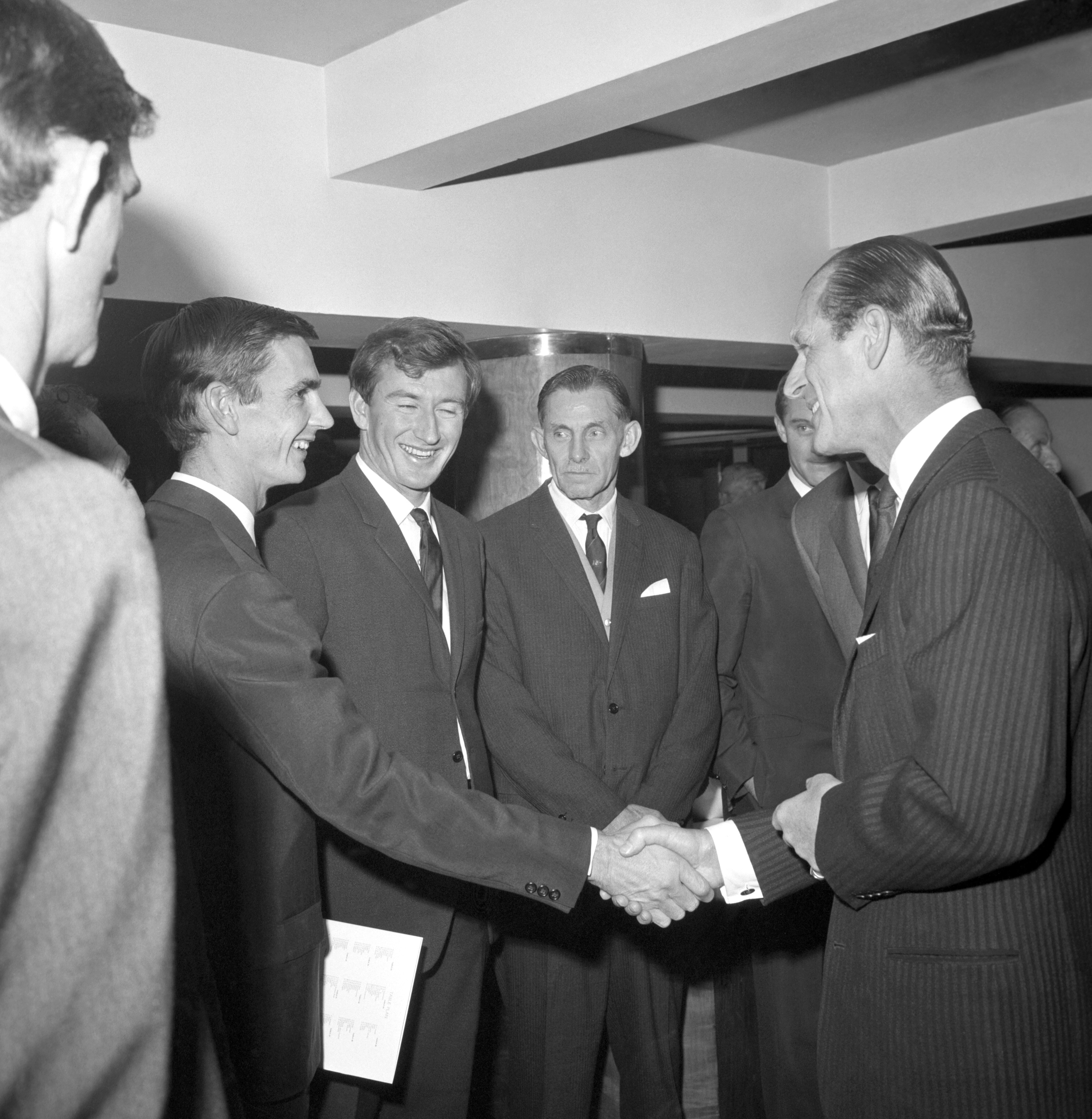 Ian Redpath shakes hands with Prince Philip at a function in 1964