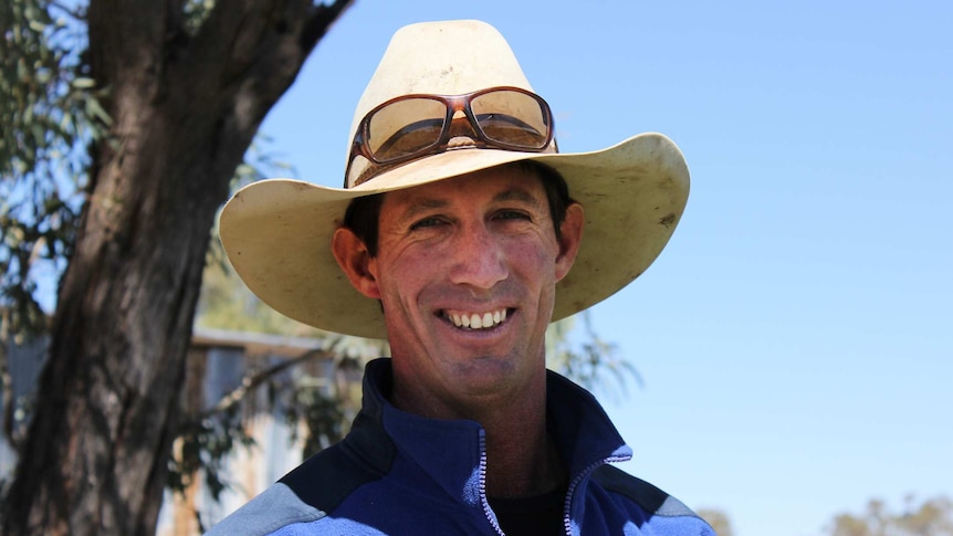 Man with hat on smiling