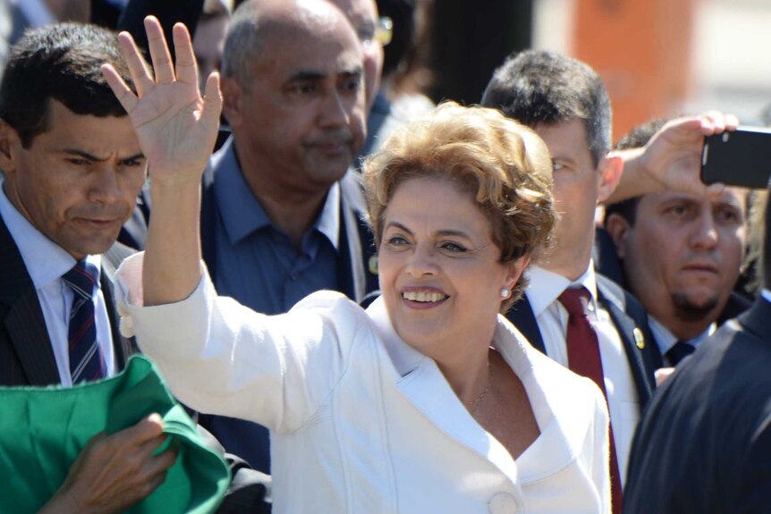Brazil's suspended President Dilma Rousseff waves to supporters.