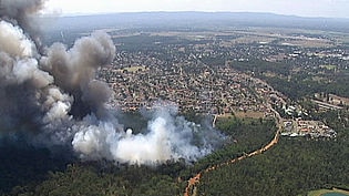 Firefighters battled bushfires in western Sydney yesterday