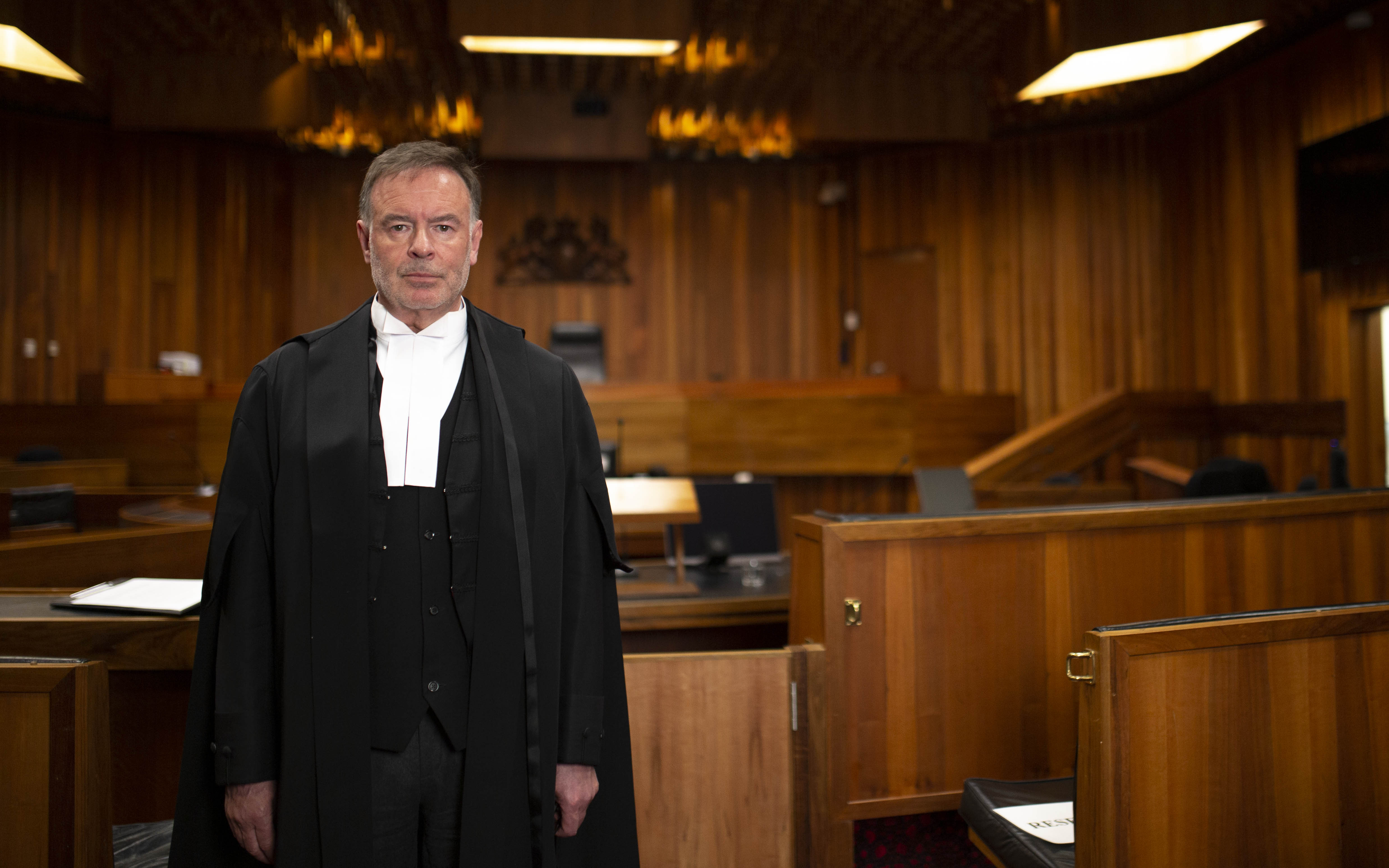 Justice Gregory Geason photographed in court in his gown.