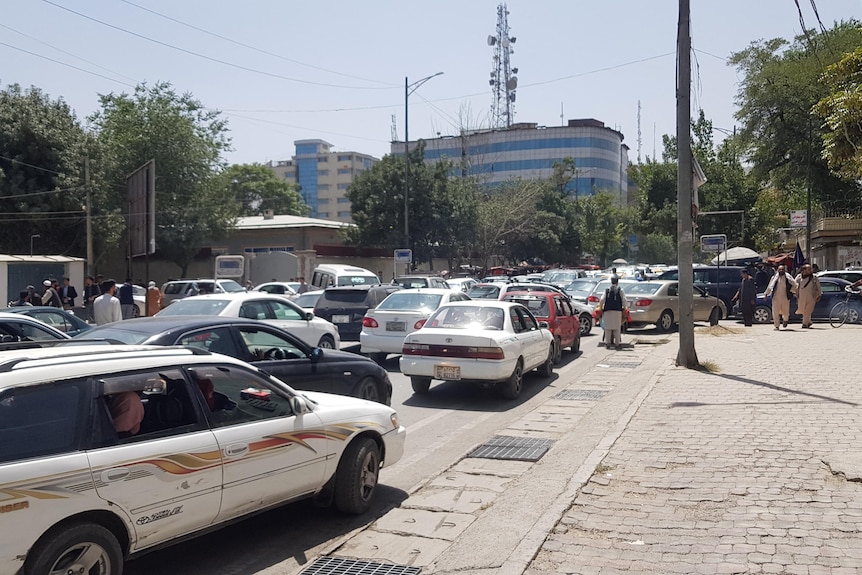Cars bank up in a street in Kabul.