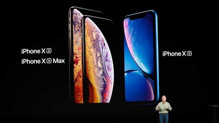 Philip W. Schiller, Senior Vice President, Worldwide Marketing of Apple stands on stage to introduce the new iPhone models