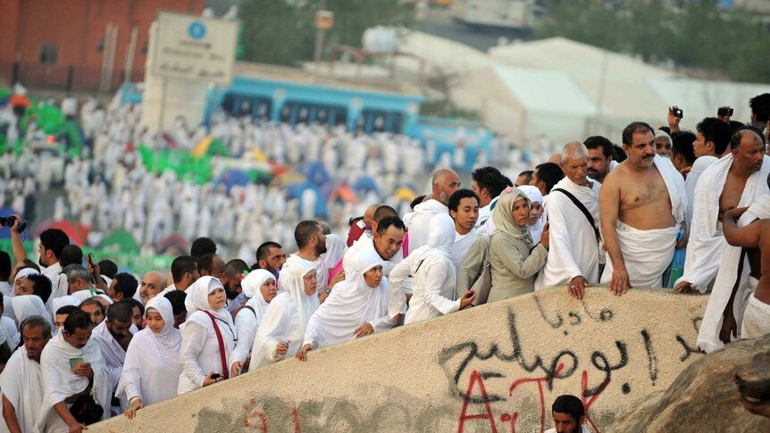 Muslim pilgrims walk up to Mount Arafat
