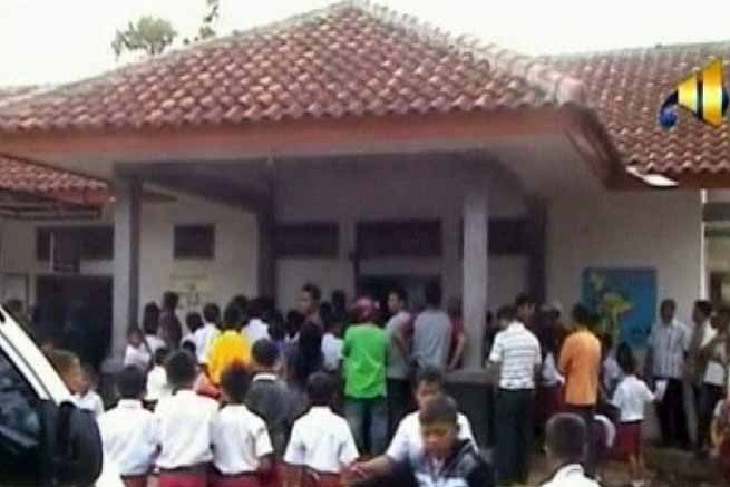 People gather at the community health clinic in Pangandaran in West Java.