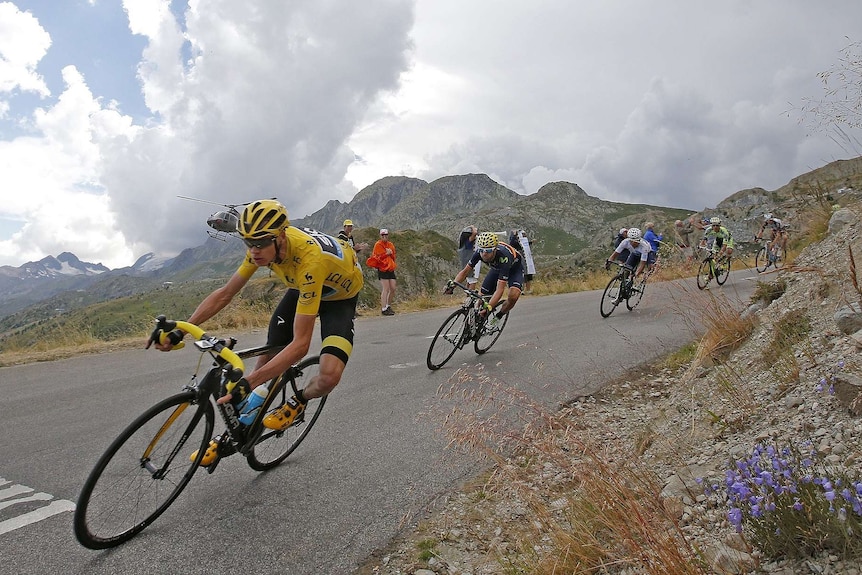 British rider Chris Froome leads the field through a sharp turn on a steep descent during the 2018 Tour de France