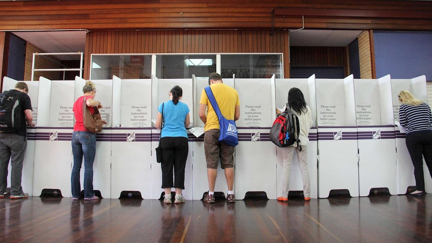 People vote at polling booths during the federal election