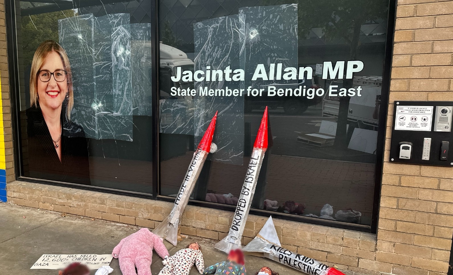 Jacinta Allan's office window cracked and smashed with rockets and bloodied baby dolls laid in front of it.