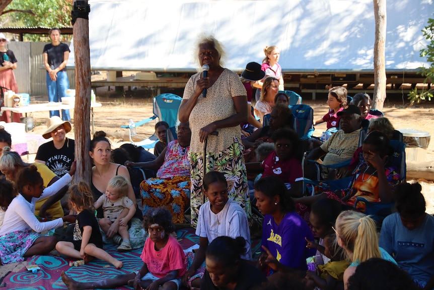 Lois Nadjamerrek speaks in front of a crowd.